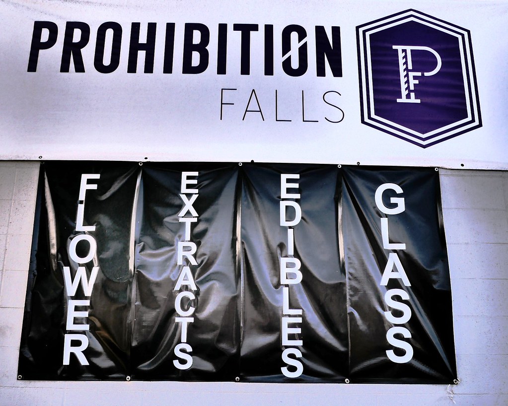 Dispensary banner listing flower, extracts, edibles and glass